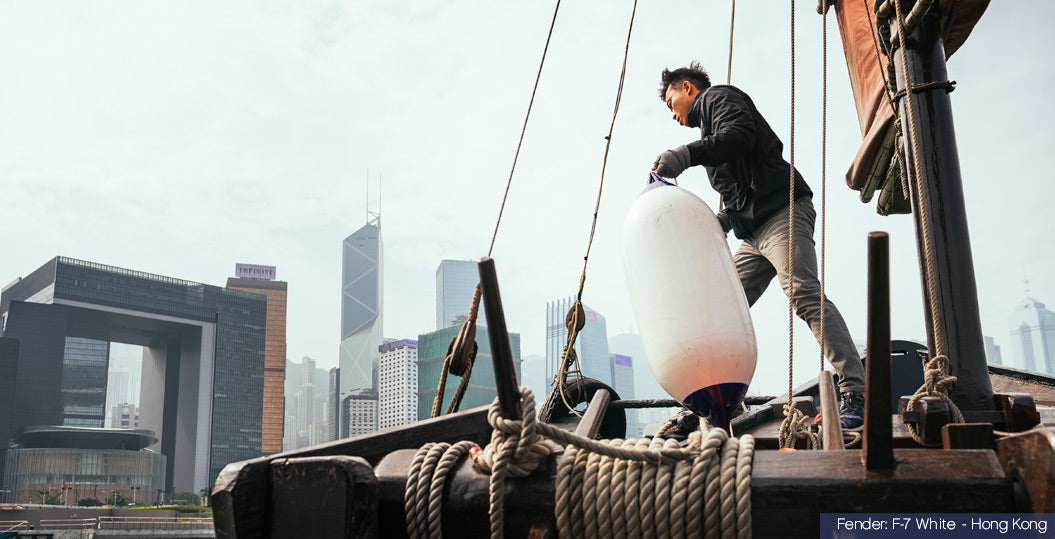 White boat fender on a sailboat in Hong Kong, Polyform F-7 White