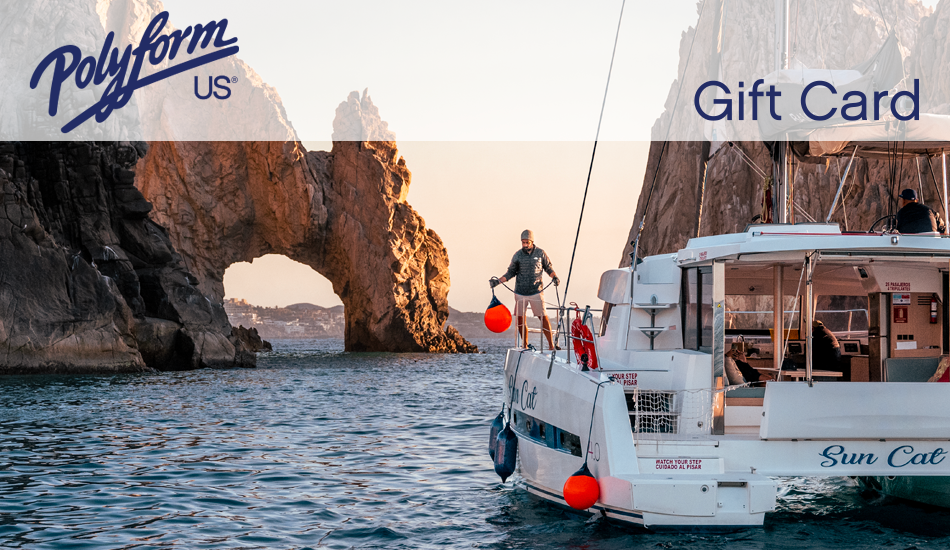 Boat fenders and buoys in use on a catamaran yacht in a rocky sea cove in Baja, Mexico