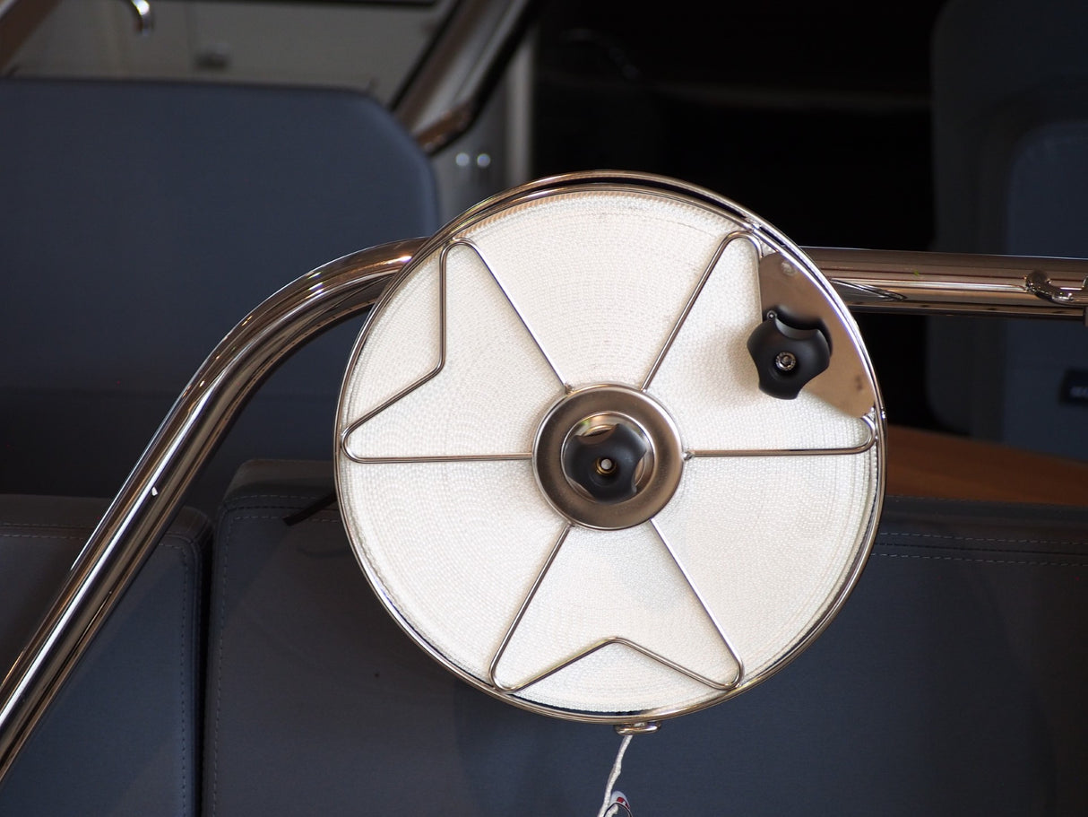 Stainless steel mooring reel with one inch polyester flat line, attached to boat railing