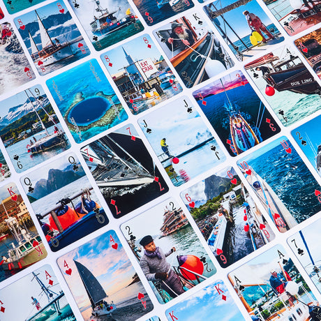 Collection of playing cards with various images showing Polyform US products in use around the world