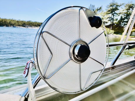 Stainless steel mooring reel with one inch polyester flat line, attached to boat railing
