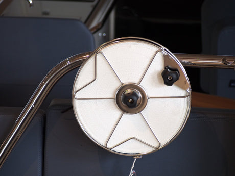 Stainless steel mooring reel with one inch polyester flat line, attached to boat railing